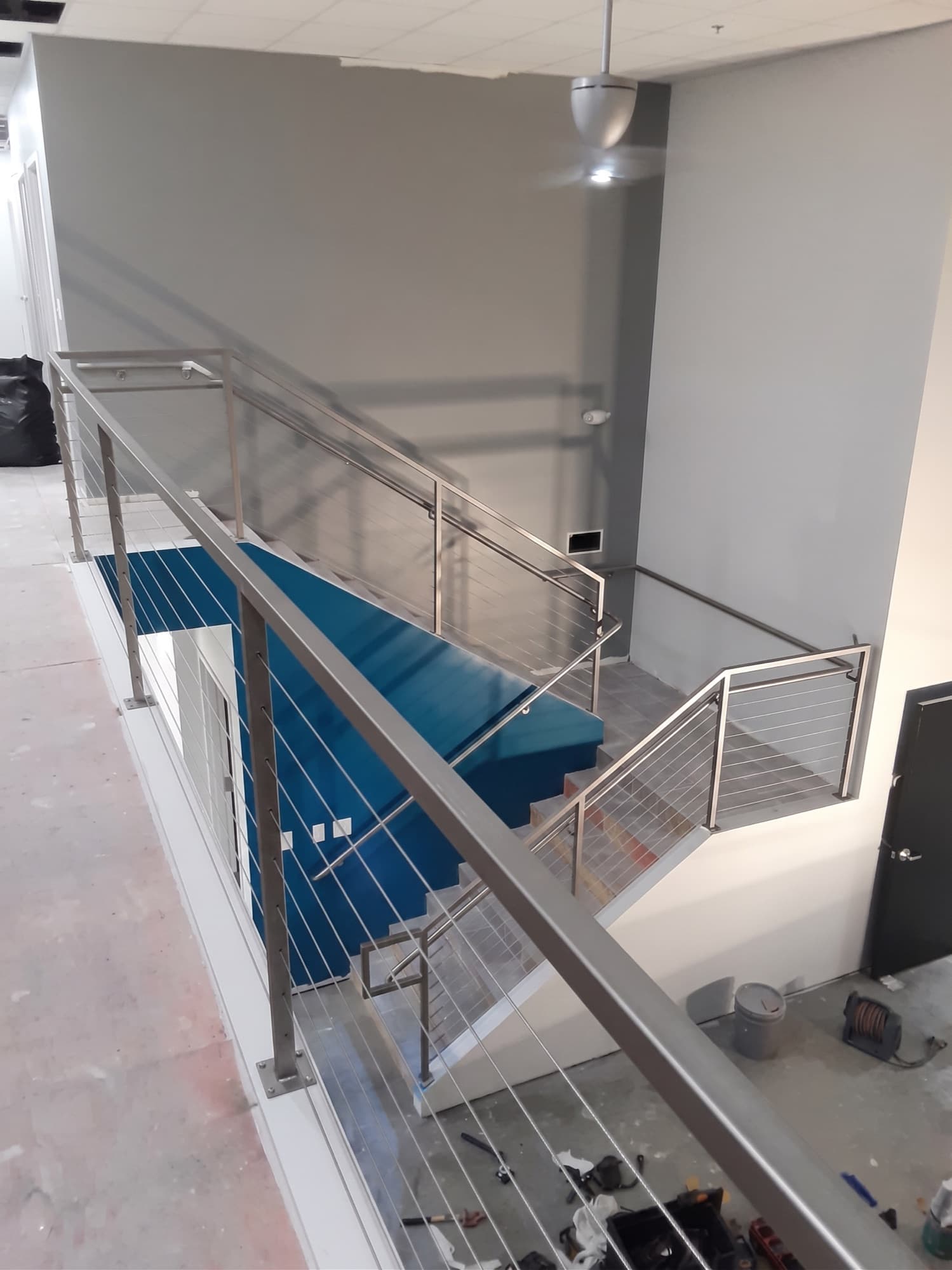 Stainless cable railing on custom steel staircase, Dallas TX