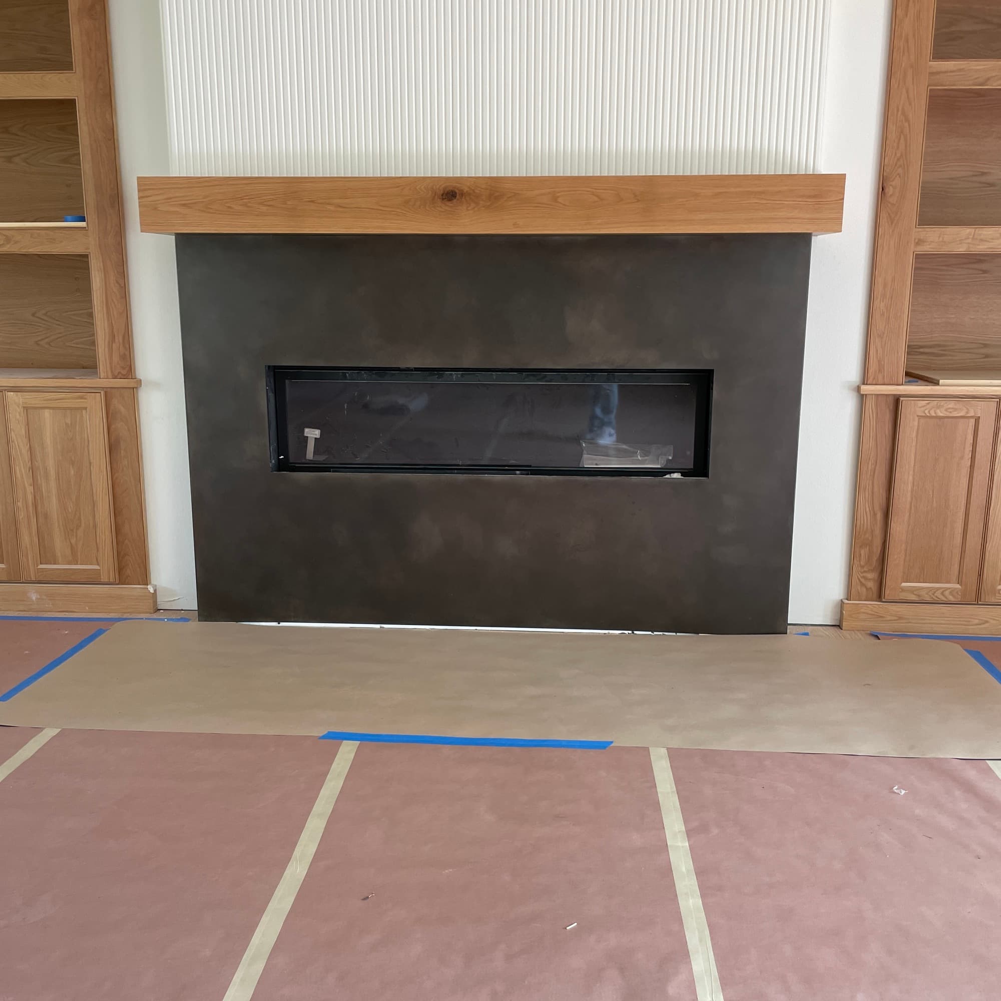 Blackened steel custom fireplace surround in a Dallas residence